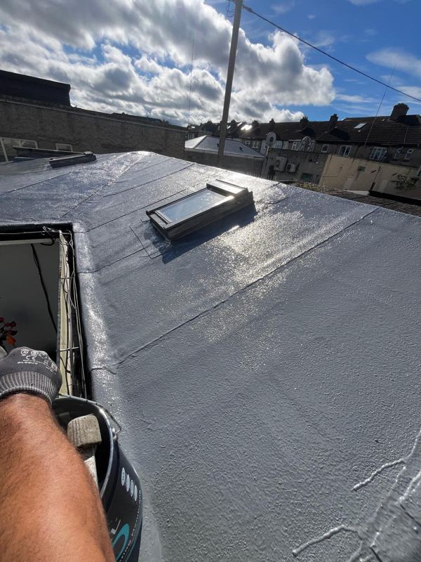 New flat roof covering around a skylight