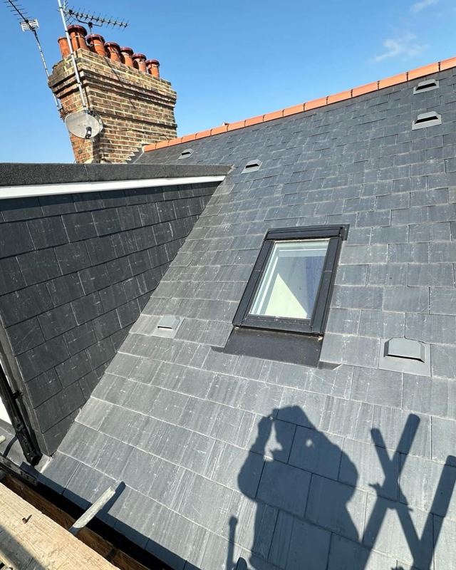 Finished slate roof with roof window